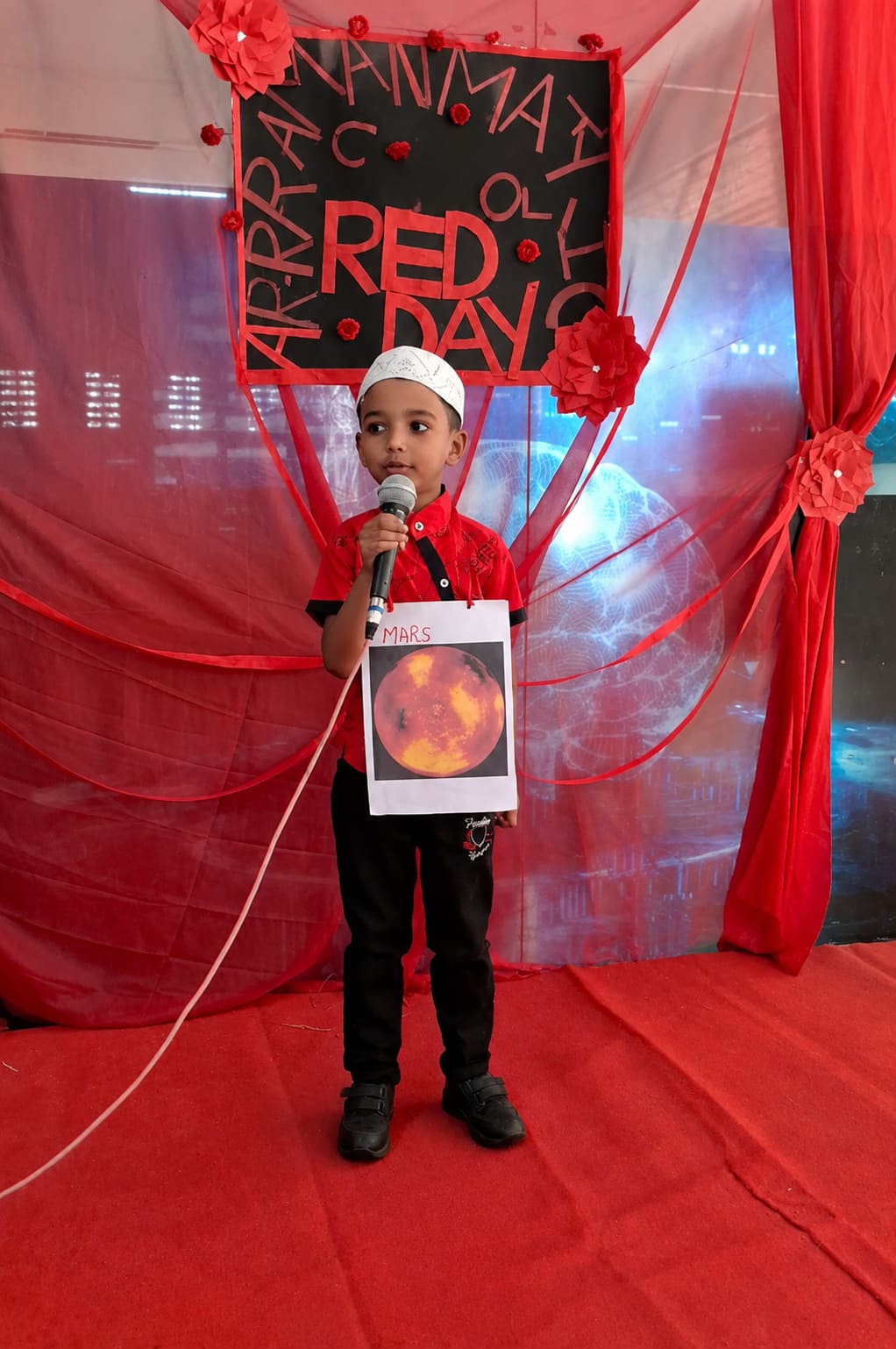 An Ar-Rahman student presenting during Red Day